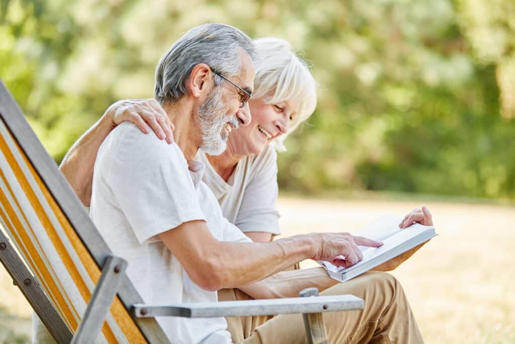 Senior couple reading book together