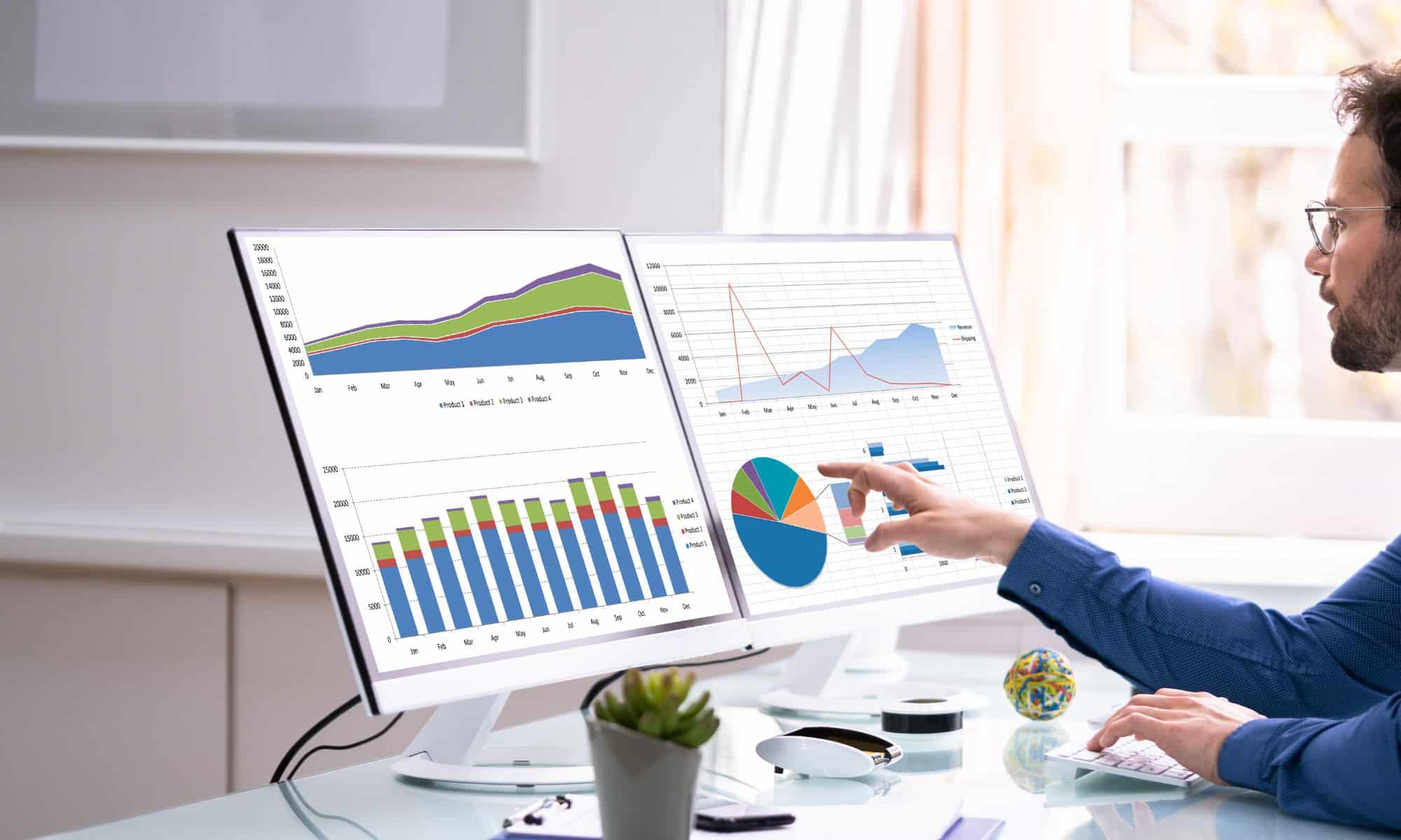 analyzing graphs displayed on the screen for strategic insights